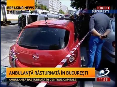 Ambulanţă răsturnată în Bucureşti. Mai multe persoane au fost rănite