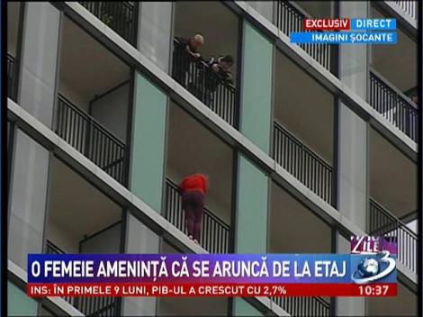 Imagini socante! O femeie ameninta ca se arunca de la etajul 14 al unui bloc din Capitala