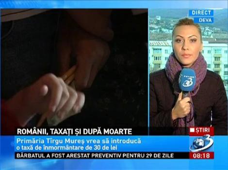Romanii, taxati si dupa moarte