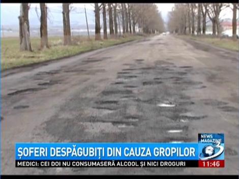 Şoferi despăgubiţi din cauza gropilor