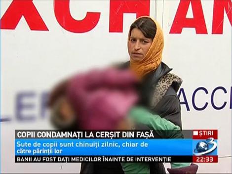 Copii condamnaţi la cerşit din faşă