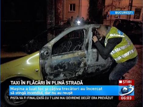 O mașină de taxi a a ars în întregime pe o stradă din Capitală