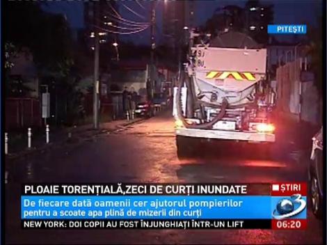 Ploaie torenţială la Piteşti! Zeci de curţi au fost inundate