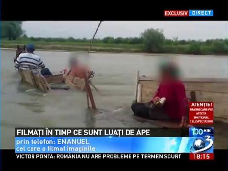 Imagini ȘOCANTE. Filmați în timp ce erau luați de apele Jiului. Doi oameni au murit