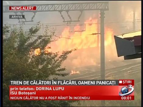 Tren de călători &icirc;n flăcări, oameni panicaţi