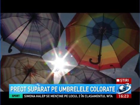 Preot supărat pe umbrelele colorate