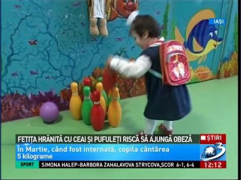 Fetiţa hrănită cu ceai şi pufuleţi riscă să devină obeză