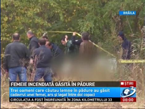 Femeie incendiată găsită în pădure