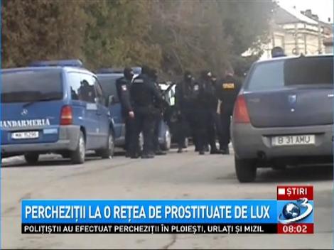 Percheziţii la o reţea de prostituare de lux