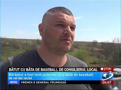 Un consilier local şi fiul său şi-au bătut un vecin cu bâta de baseball, până l-au băgat în spital