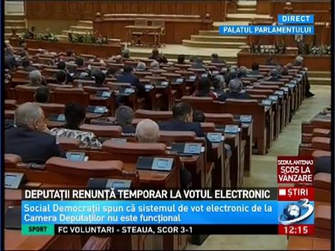 Deputații renunță temporar la votul electronic