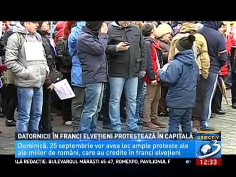 Datornicii în franci elvețieni protestează în capitală