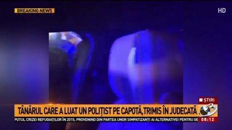 Șoferul care a luat un poliţist pe capotă și l-a târât, trimis în judecată