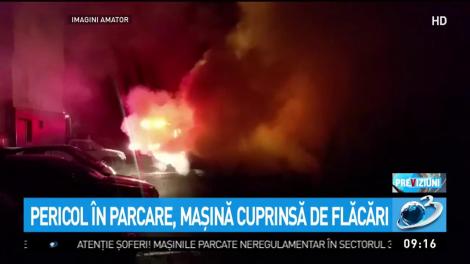 Pericol &icirc;n parcare, mașină cuprinsă de flăcări