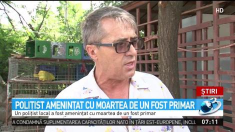 Poliţist ameninţat cu moartea de un fost primar