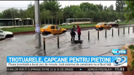 Rupere de nori &icirc;n Bucureşti. Capitala, sub ape după o ploaie puternică