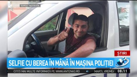 Selfie cu berea &icirc;n m&acirc;nă &icirc;n maşina poliţiei
