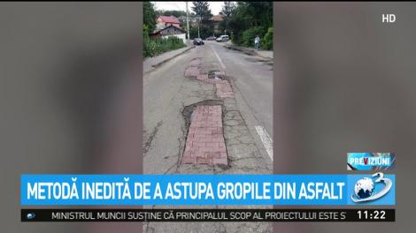 Metodă inedită de a astupa gropile din asfalt
