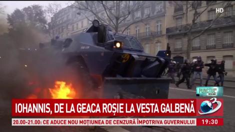 Iohannis, de la geaca roşie la vesta galbenă