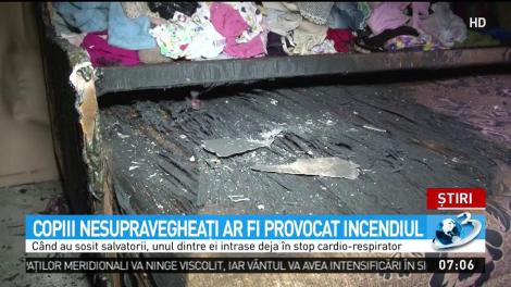 Casă cuprinsă de flăcări, doi copii la spital
