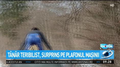 T&acirc;năr teribilist, surprins pe plafonul maşinii