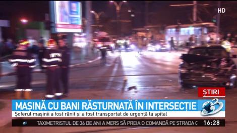 Maşină cu bani răsturnată &icirc;ntr-o intersecţie din Capitală