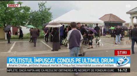 Poliţistul &icirc;mpuşcat, condus pe ultimul drum