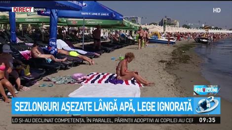 Şezlonguri aşezate l&acirc;ngă apă, lege ignorată