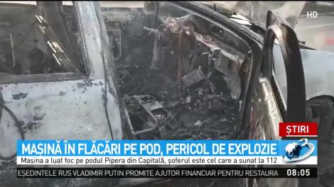Panică &icirc;n traficul din București! Mașină &icirc;n flăcări pe pod, la un pas de explozie