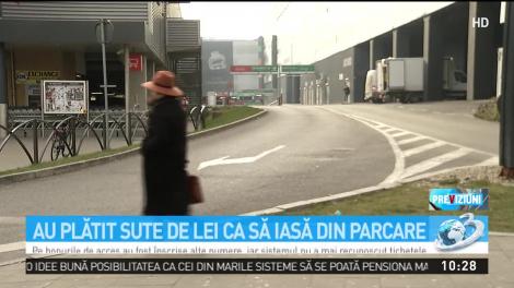 Scandal uriaş într-un mall din Capitală! Şoferii, nevoiţi să plătească 100 de lei pentru a ieşi din parcare