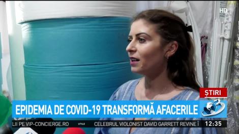 Epidemia de Covid-19 transformă afacerile. Un magazin de perdele produce acum măşti şi combinezoane