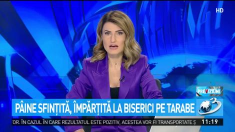 Pâine sfinţită, împărţită pe tarabe la biserici