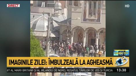 &Icirc;mbulzeală la agheasmă. Zeci de credincioși s-au călcat &icirc;n picioare pentru Apa Sfințită