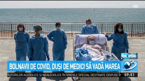 Bolnavii de coronavirus, duși de medici, cu tot cu paturi, să vadă marea. Imagini emoționante în Spania