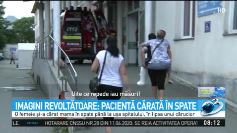 Pacientă cărată în spate de fiica sa, după ce a stat o oră în mașină pentru că ministrul Sănătății se afla în spital! Cum a justificat incidentul Tătaru
