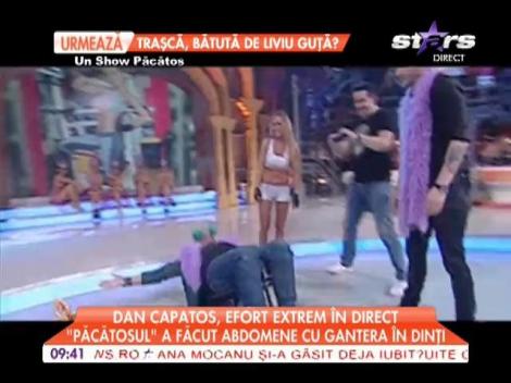 Dan Capatos a făcut abdomene în direct, cu o ganteră între dinţi
