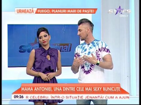 VIDEO / Explozie de senzualitate la primele ore ale dimineţii! A &icirc;mbrăcat un costum irezistibil de sexy şi s-a lăsat m&acirc;ng&acirc;iată de doi bărbaţi, &icirc;n direct! Imaginile sunt incendiare