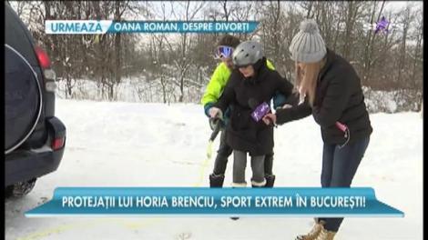 Vlad și Andra, membrii trupei Instinct, foști concurenți X Factor, se dau cu placa de snowboard prin Capitala înzăpezită