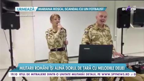 Militarii români își alină dorul de țară cu melodiile Deliei