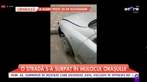 Un șofer s-a trezit cu mașina într-un carter imens format pe o stradă din Râmnicu Sărat!